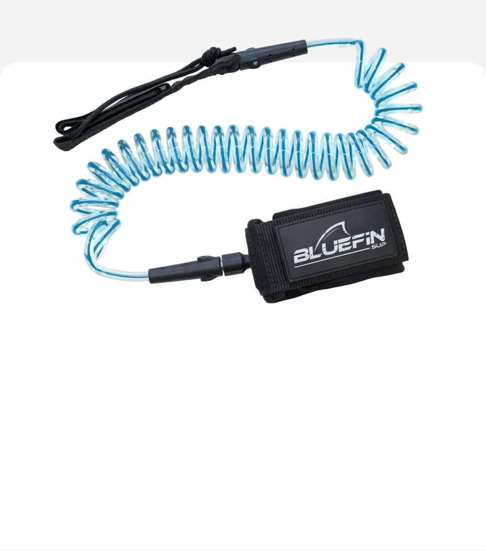 Coiled safety leash with black strap and blue cord, featuring a Bluefin SUP logo on the attachment.