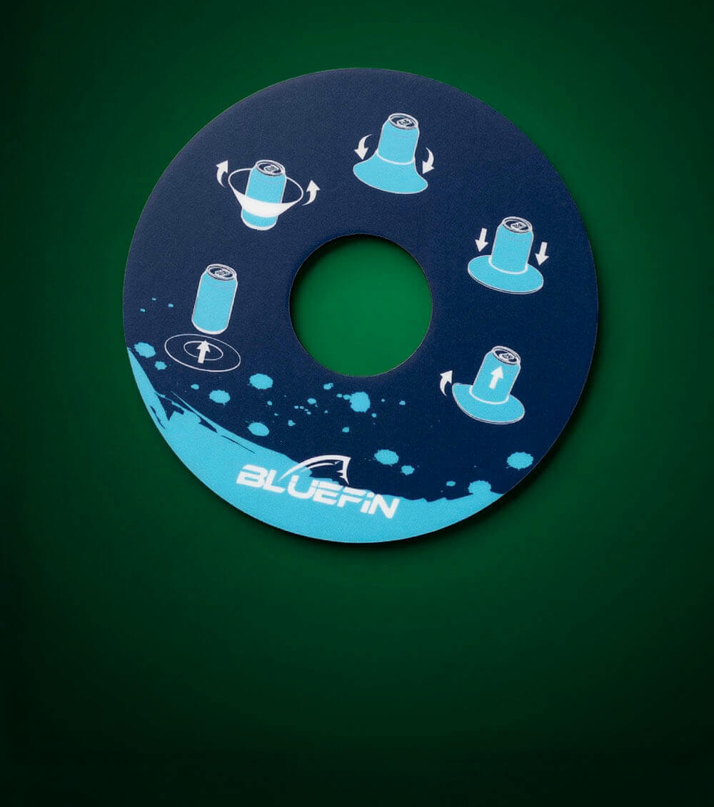Round blue instruction disc with graphics for can placement and rotation, featuring Bluefin logo.