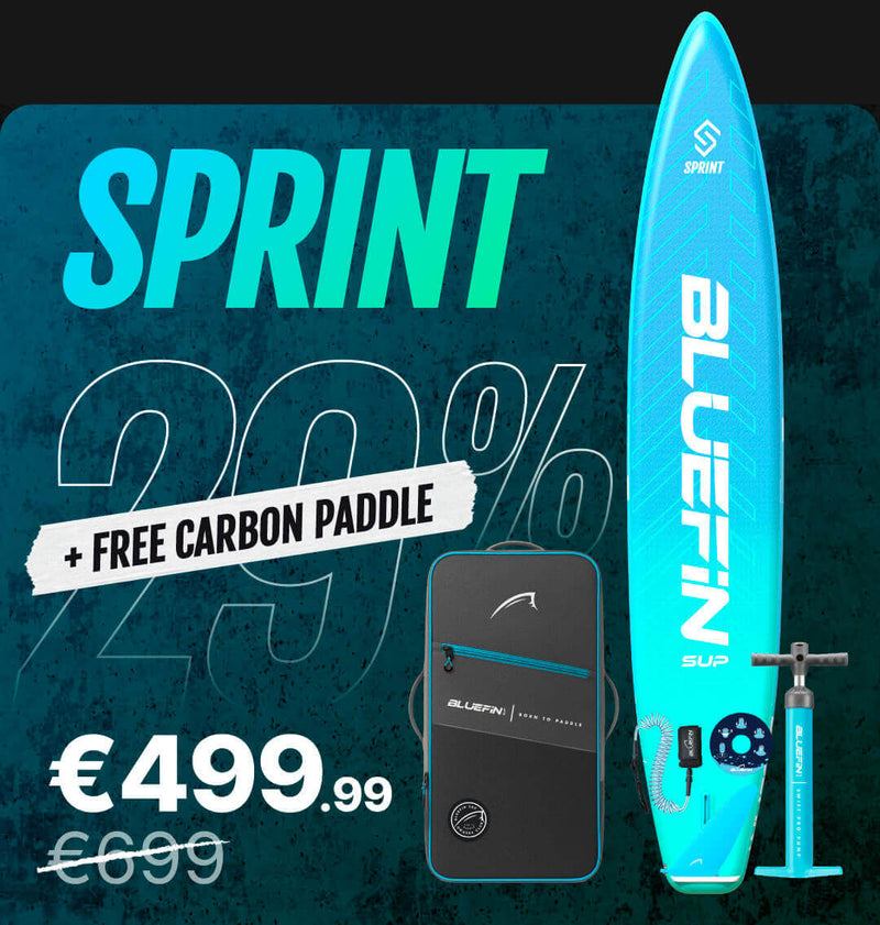 Inflatable paddleboard with blue design, carrying bag, carbon paddle, and pump, showing 29% discount.
