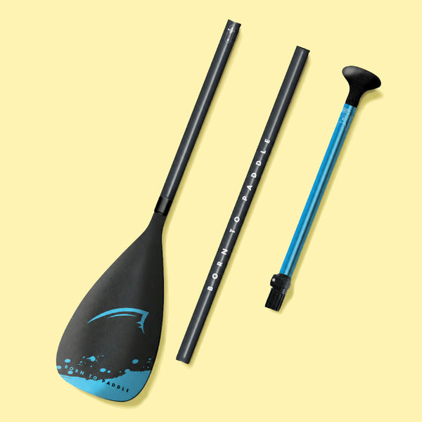 Three-piece paddle with a black blade, black shaft, and blue handle, featuring 'Born to Paddle' text.