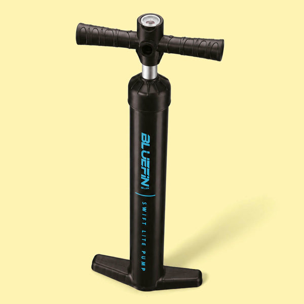 Black hand pump with textured handles and pressure gauge for inflating paddleboards